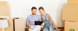 Couple uses Ipad to read a blog about property management